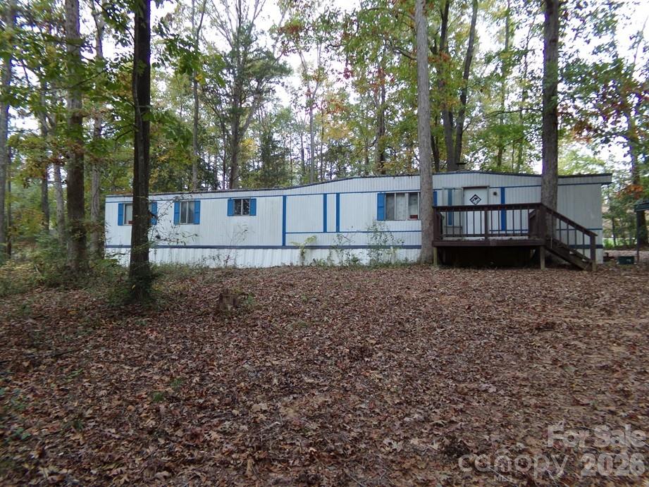 627 Bolick Road Fort Mill, SC 29707 - Photo 13 of 20 a view of house with backyard and trees