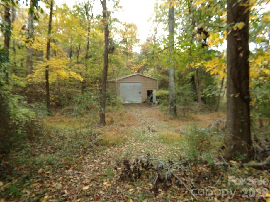 627 Bolick Road Fort Mill, SC 29707 - Photo 19 of 20 a view of a large garden with plants and large trees