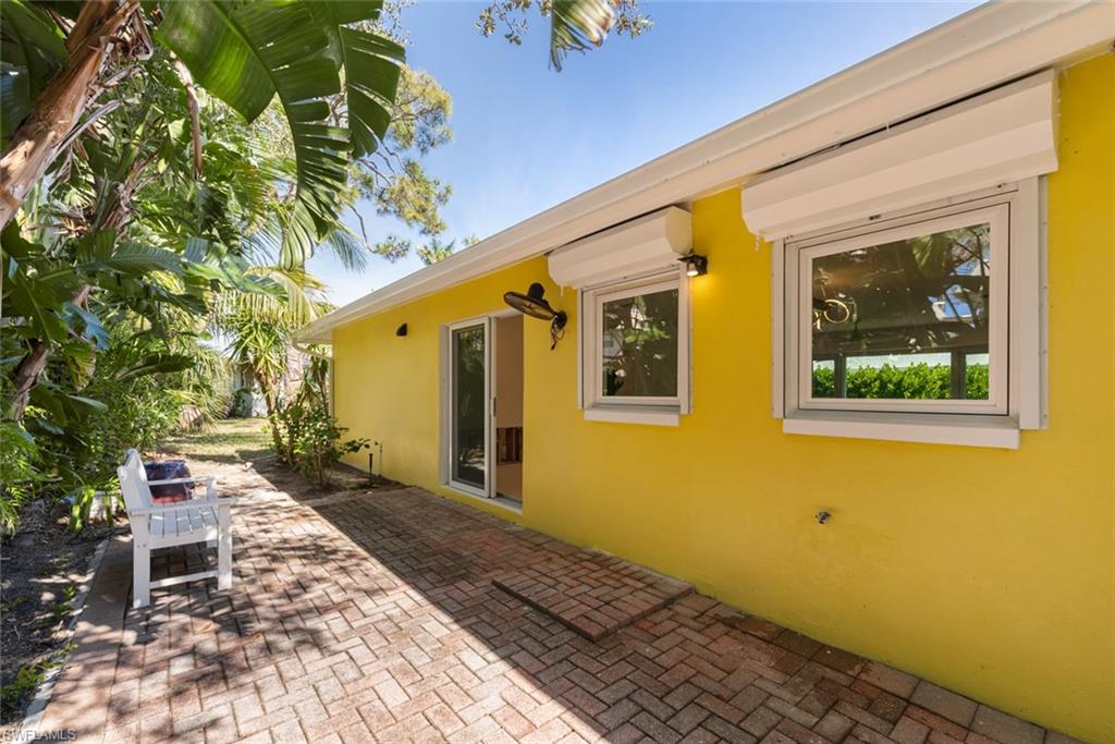 24 Rivard Road, Unit 12 Naples, FL 34112 - Photo 23 of 27 View of patio with a wall mounted AC