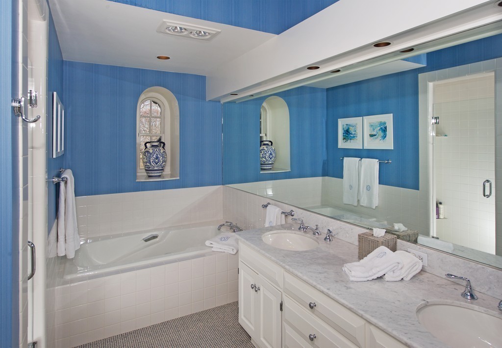 17 Bradlee Road Marblehead, MA 01945 - Photo 14 of 28 a bathroom with a tub sink and mirror