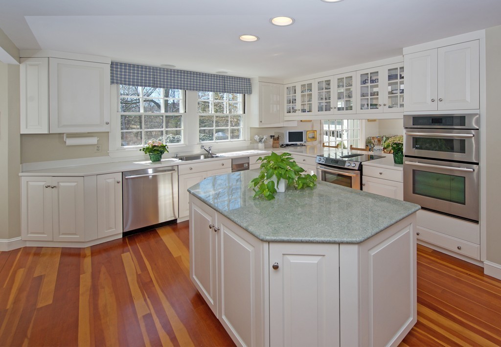 17 Bradlee Road Marblehead, MA 01945 - Photo 4 of 28 a kitchen with stainless steel appliances granite countertop a stove a sink and a microwave