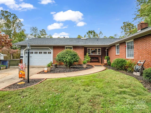 a front view of a house with large windows