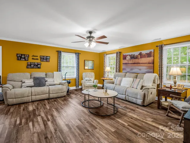 a living room with furniture and a table