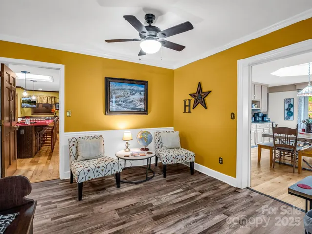 a view of a dining room with furniture window and wooden floor