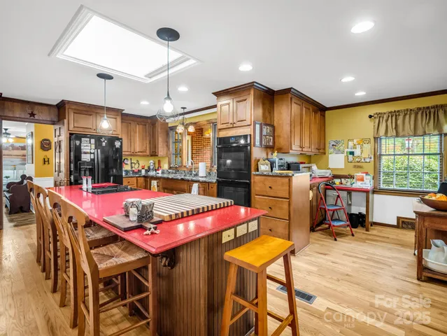 a room with pool table and windows
