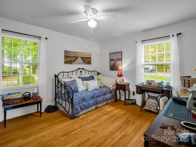 a bedroom with a bed and a couch