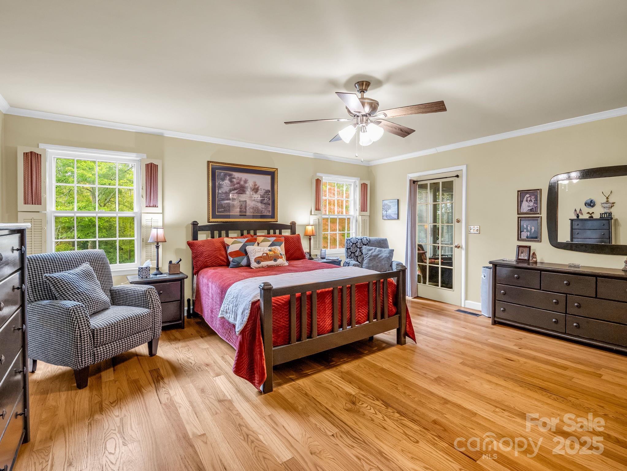 343 Nebraska Street Spindale, NC 28160 - Photo 44 of 46 a bedroom with a bed dresser and wooden floor