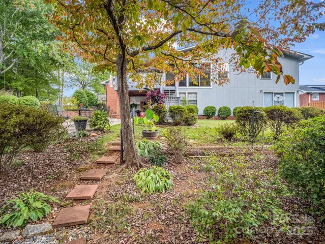 a backyard of a house with lots of green space