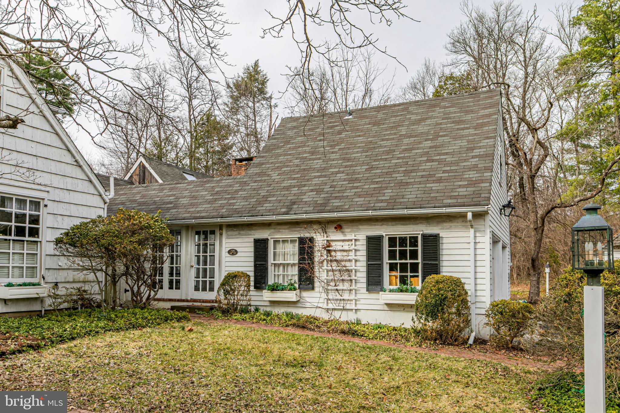 607 Rosedale Road Princeton, NJ 08540 - Photo 2 of 12 a front view of a house with garden