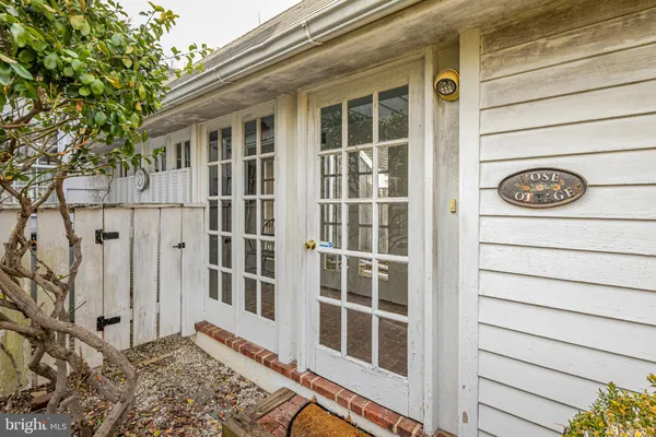 a view of a house with a door and a window