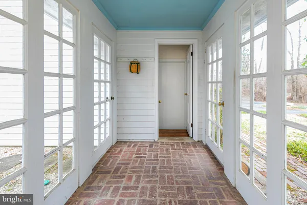 a view of a hallway with windows
