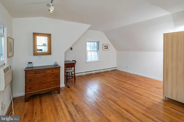 a room with furniture and a wooden floor