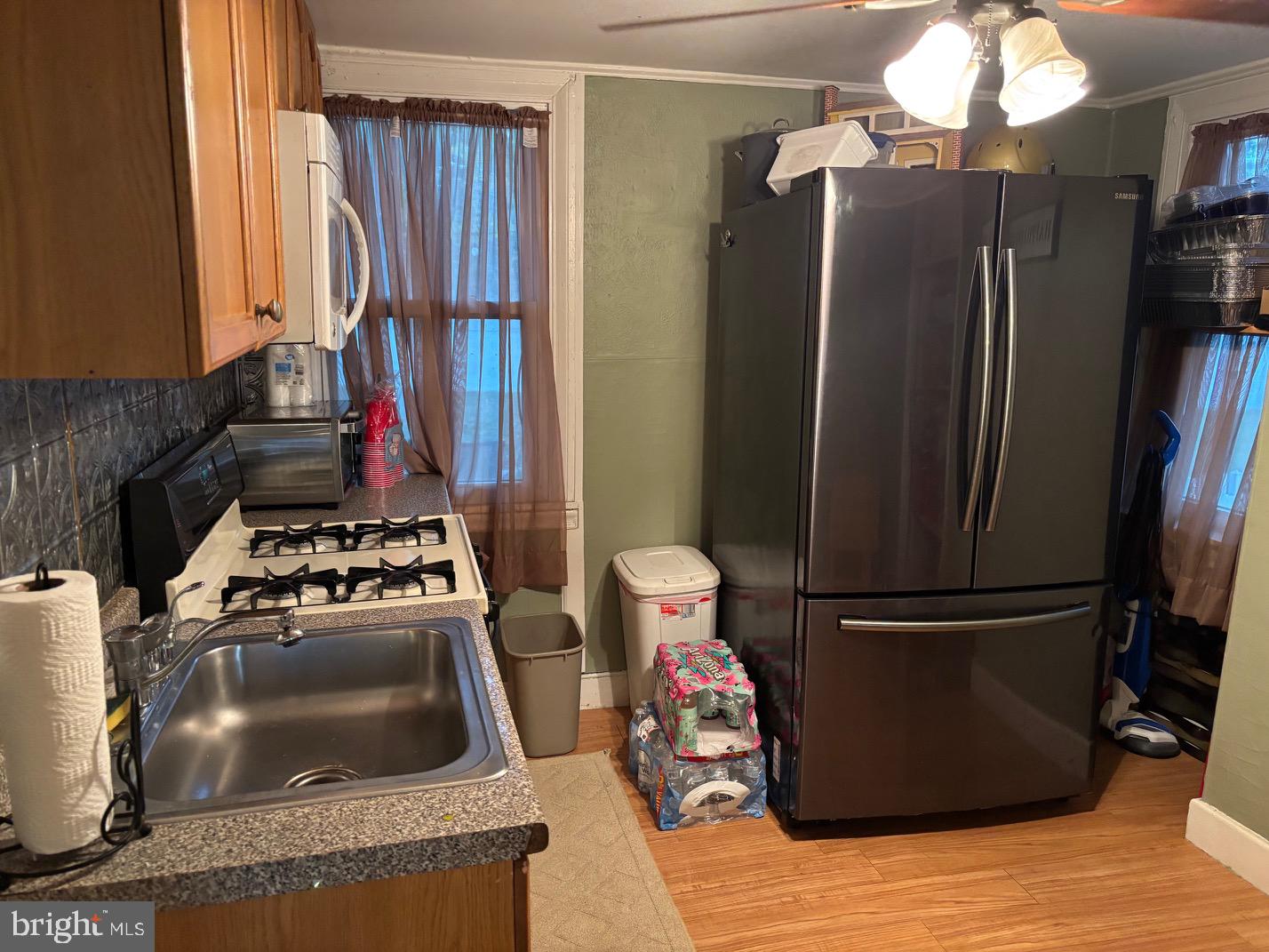 70 Main Street Waretown, NJ 08758 - Photo 26 of 55 a kitchen with stainless steel appliances granite countertop a refrigerator and a stove