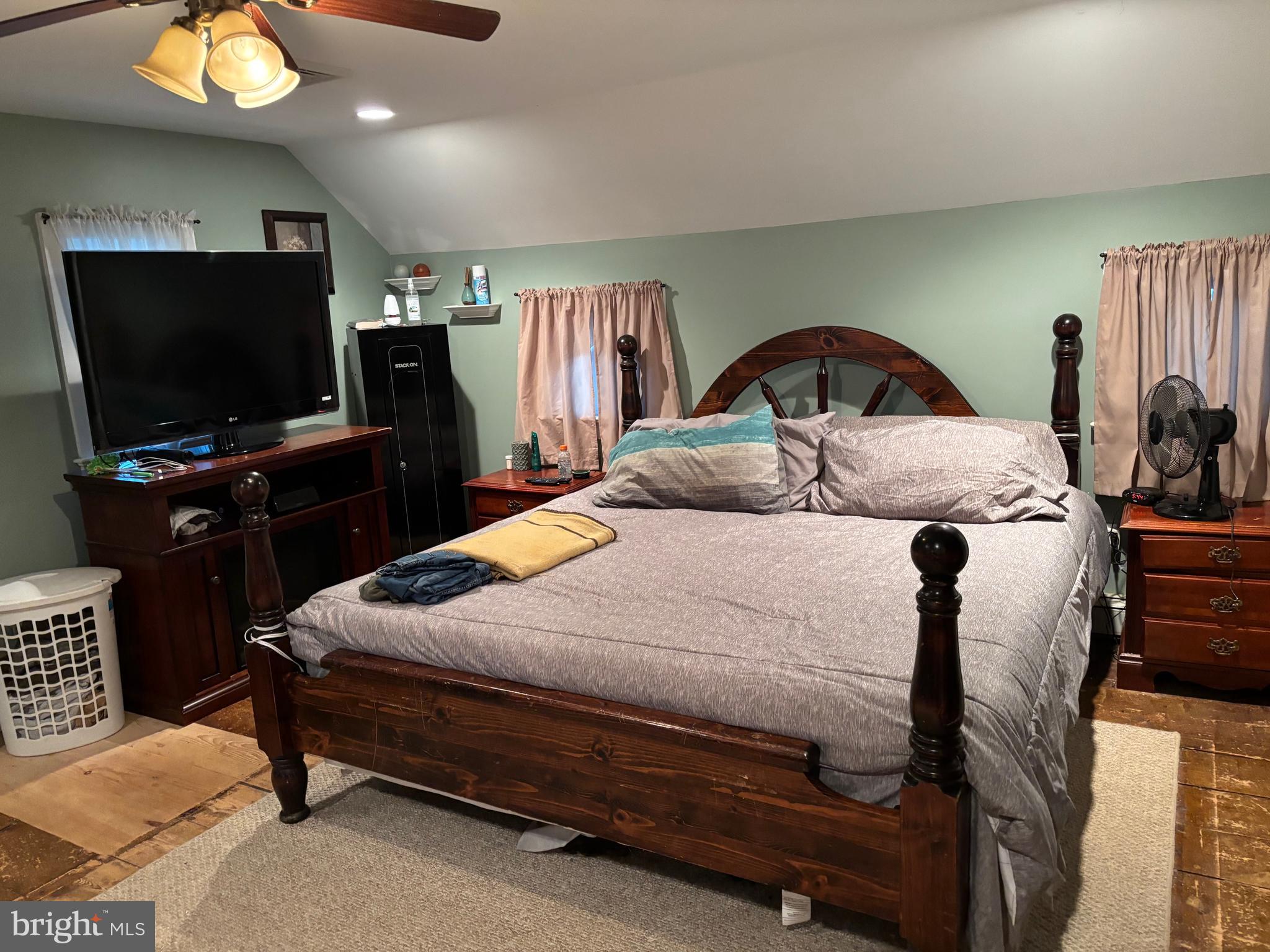 70 Main Street Waretown, NJ 08758 - Photo 33 of 55 a bedroom with a bed and a flat screen tv