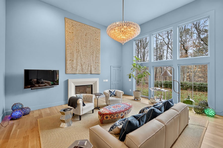 280 Ice Valley Road Osterville, MA 02655 - Photo 13 of 42 a living room with furniture a chandelier and a flat screen tv