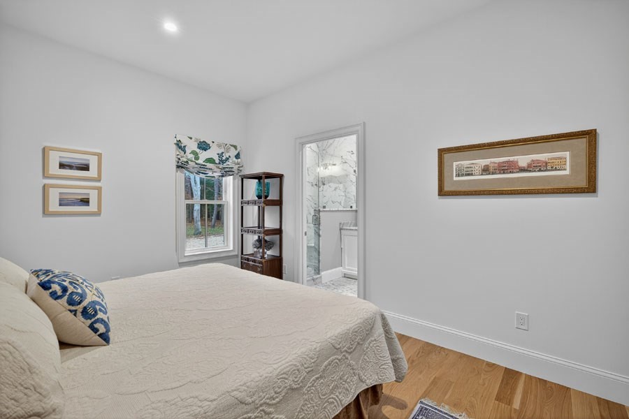 280 Ice Valley Road Osterville, MA 02655 - Photo 27 of 42 a bedroom with a large bed and a window