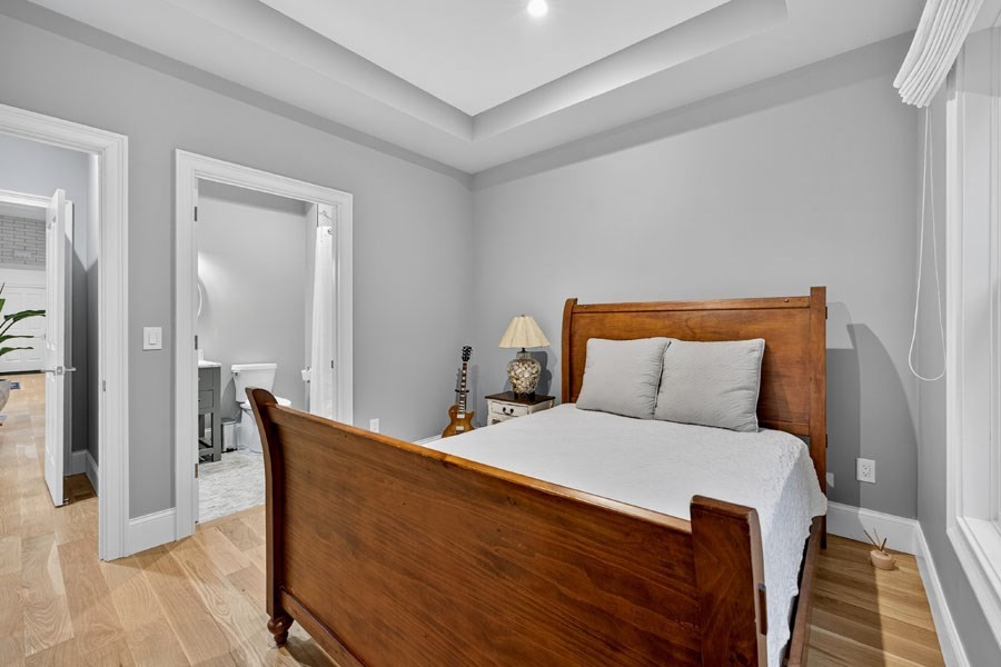 280 Ice Valley Road Osterville, MA 02655 - Photo 29 of 42 a bed room with a bed and a chair