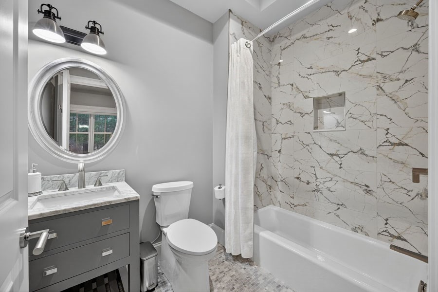 280 Ice Valley Road Osterville, MA 02655 - Photo 30 of 42 a bathroom with a sink toilet and shower