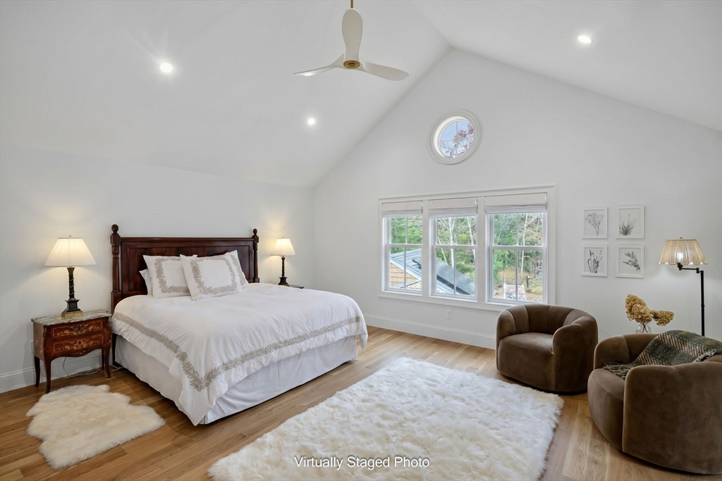 280 Ice Valley Road Osterville, MA 02655 - Photo 33 of 42 a spacious bedroom with a bed and a large window