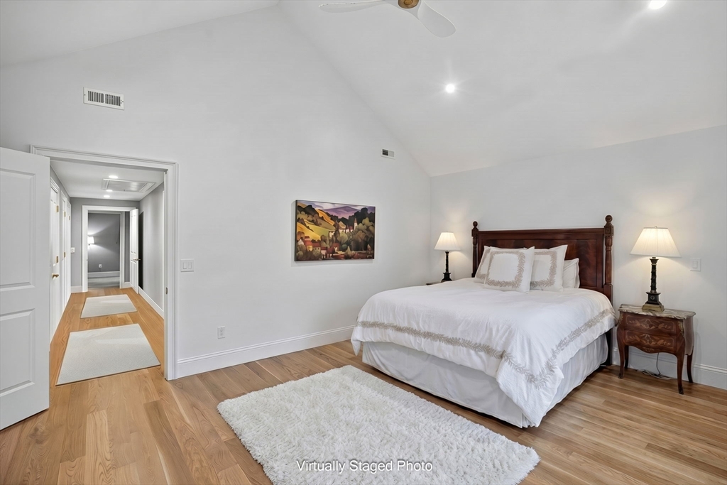 280 Ice Valley Road Osterville, MA 02655 - Photo 34 of 42 a bedroom with a bed and wooden floor