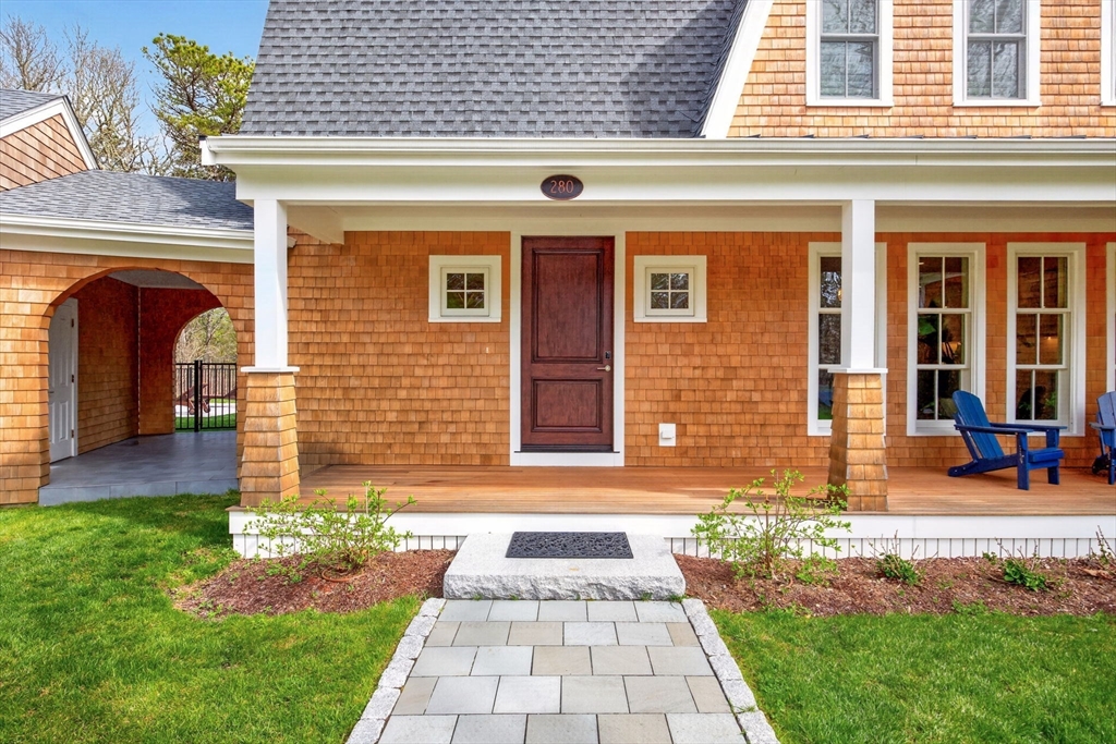 280 Ice Valley Road Osterville, MA 02655 - Photo 5 of 42 a front view of a house with garden