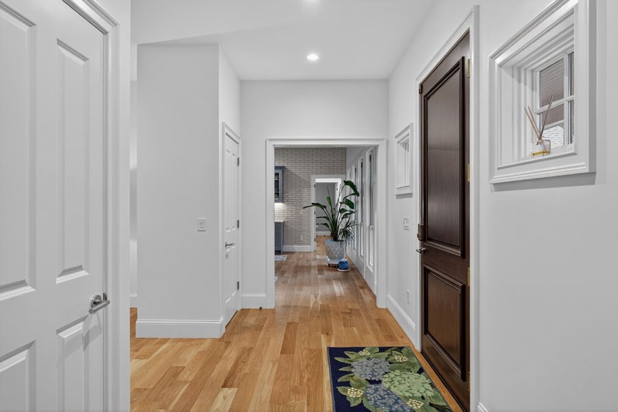 280 Ice Valley Road Osterville, MA 02655 - Photo 7 of 42 a view of a hallway with wooden floor and furniture