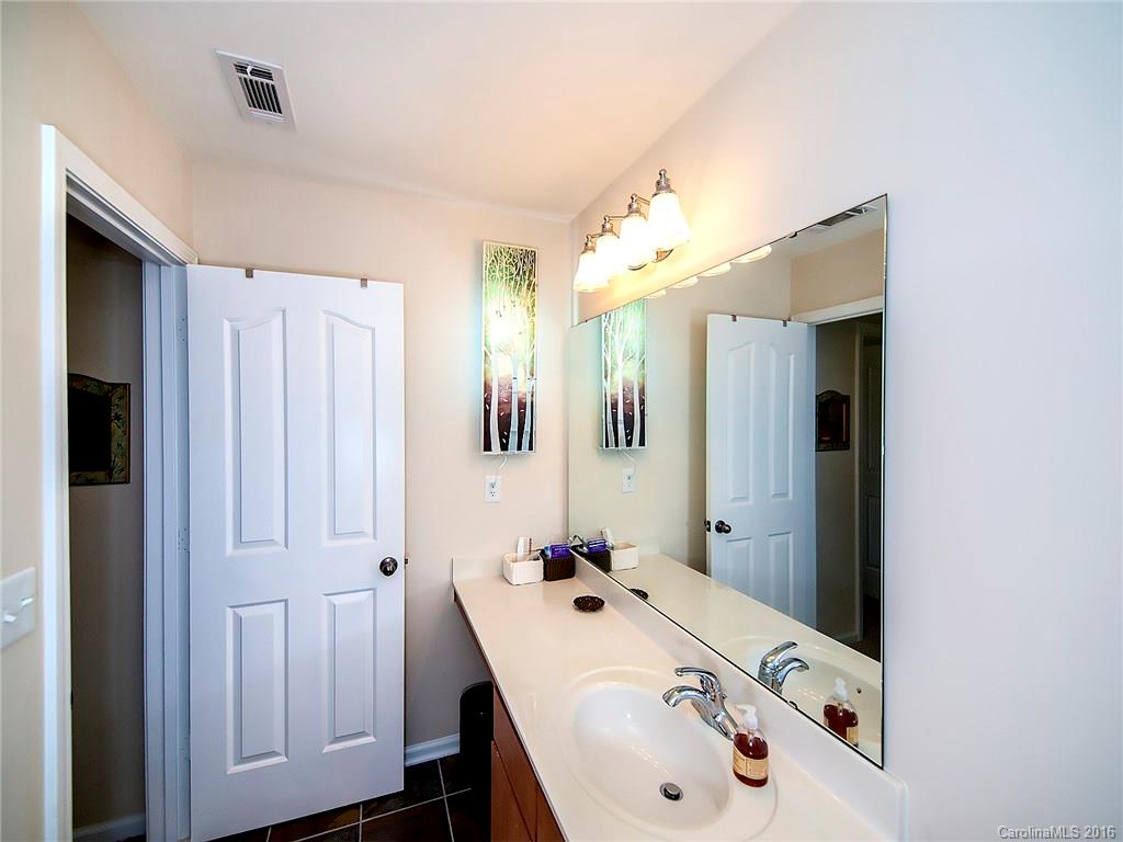 264 River Clay Road, Unit 211 Fort Mill, SC 29708 - Photo 12 of 23 a bathroom with a tub sink and mirror
