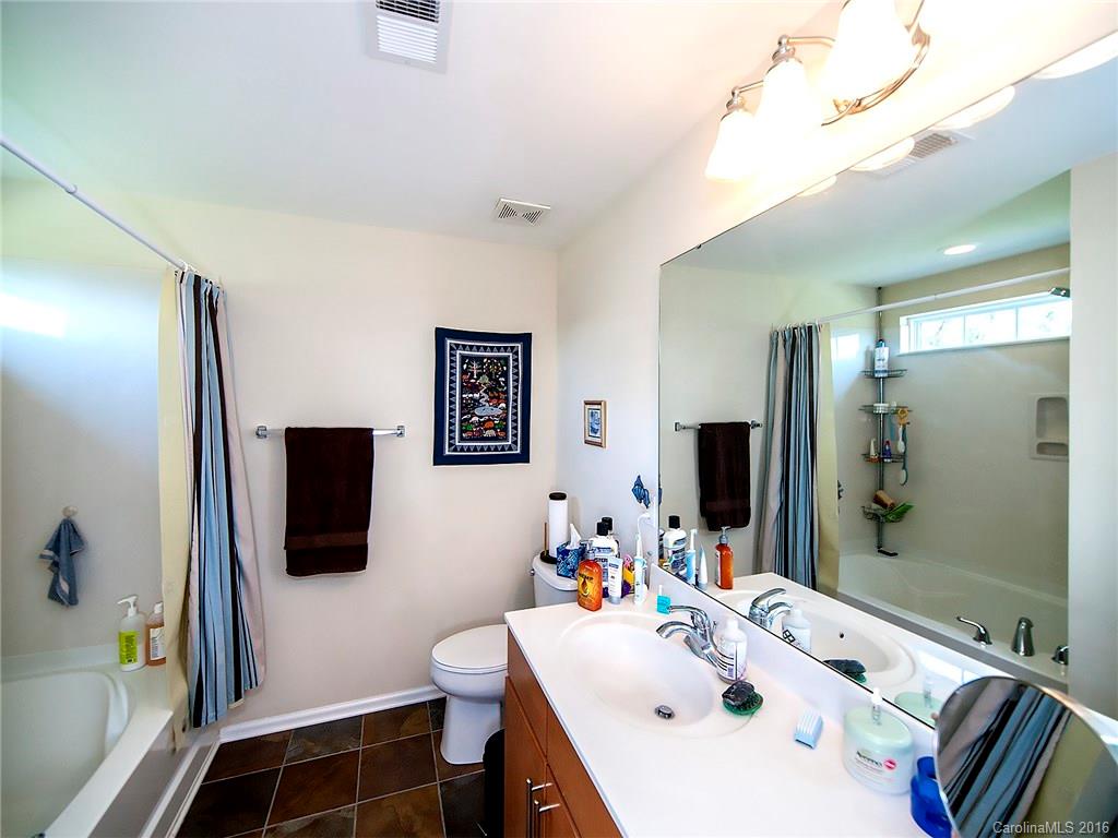 264 River Clay Road, Unit 211 Fort Mill, SC 29708 - Photo 15 of 23 a bathroom with a sink a toilet and mirror