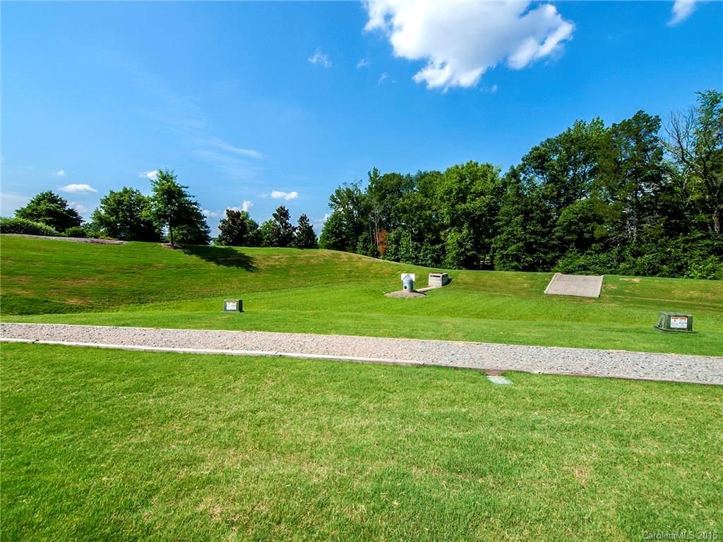 264 River Clay Road, Unit 211 Fort Mill, SC 29708 - Photo 19 of 23 a view of a golf course with a lake