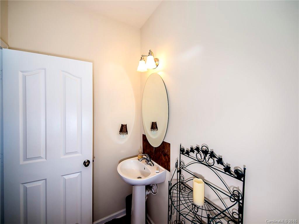 264 River Clay Road, Unit 211 Fort Mill, SC 29708 - Photo 3 of 23 a bathroom with a sink a mirror and a toilet