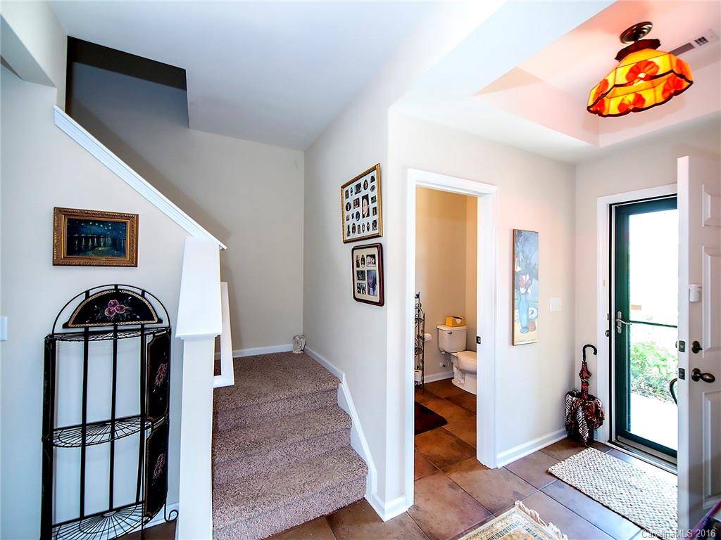 264 River Clay Road, Unit 211 Fort Mill, SC 29708 - Photo 4 of 23 a view of hallway with wooden floor and stairs
