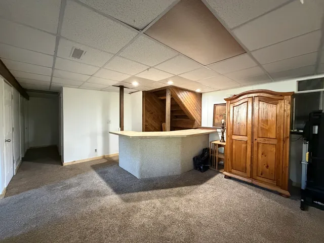 a view of a big room with wooden walls