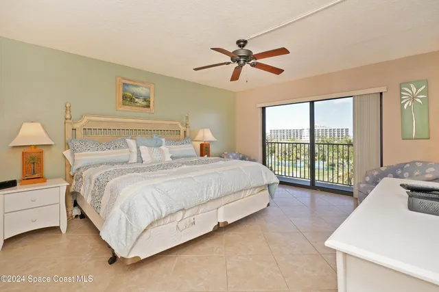 a bathroom with a granite countertop toilet sink and a mirror
