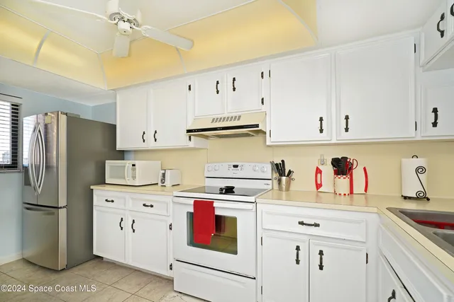 a view of a building with a small backyard