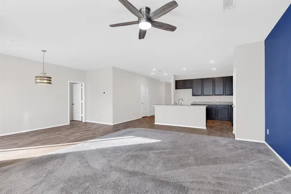 a view of a kitchen with a sink and a window