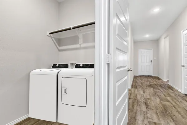 a view of storage and utility room with washer and dryer