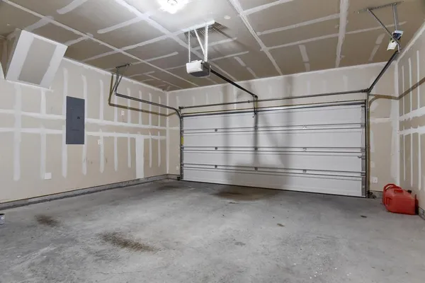 a view of an empty room with white walls