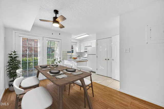 a view of livingroom and kitchen with furniture wooden floor and window