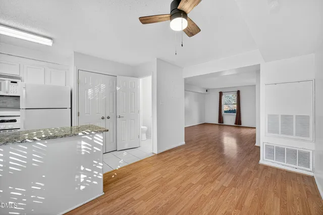 a view of a dining room and livingroom with furniture