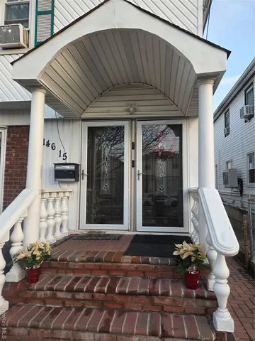 a front view of a house with a garage