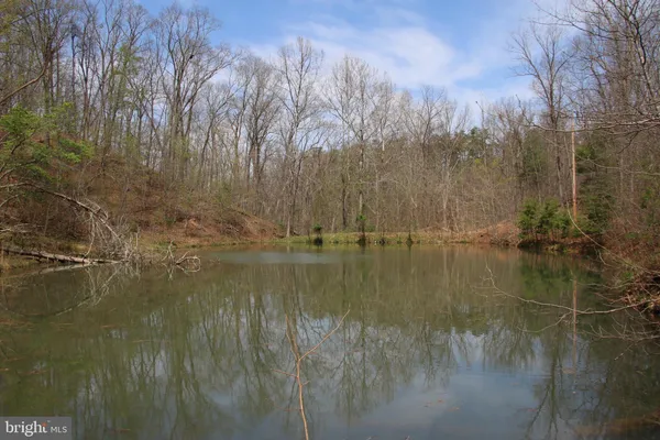 a view of lake with green space