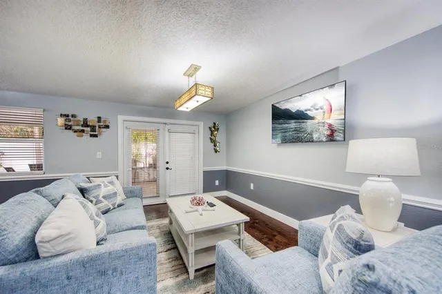 a bedroom with furniture and a wooden floor