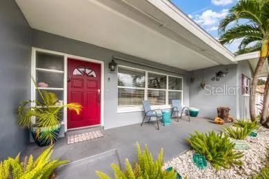 a view of a chairs in front of a house