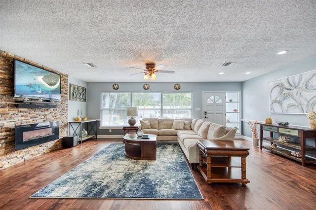 a living room with furniture and a large window