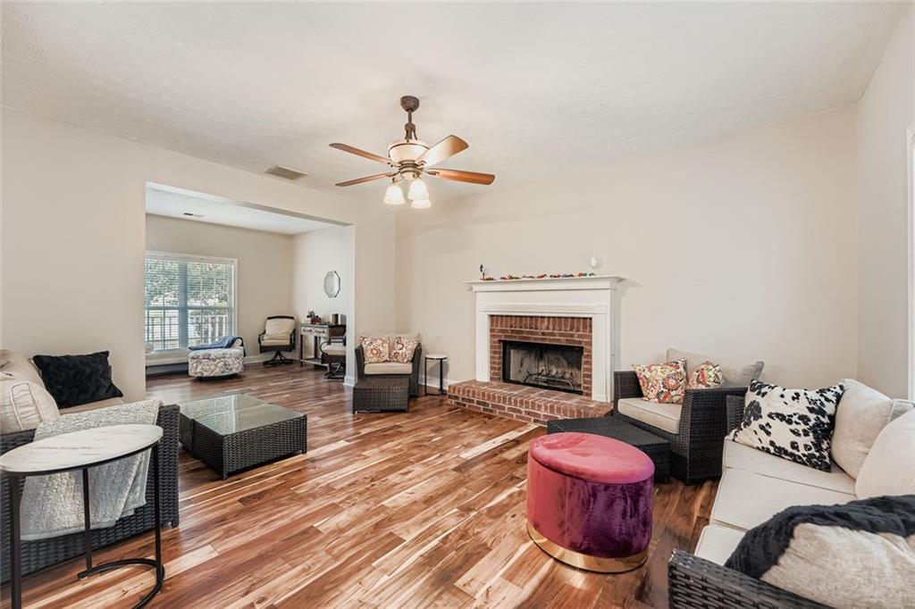 2409 Caneridge Way Southwest Marietta, GA 30064 - Photo 14 of 28 a living room with furniture and a fireplace