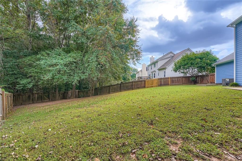 2409 Caneridge Way Southwest Marietta, GA 30064 - Photo 28 of 28 a view of outdoor space with a garden