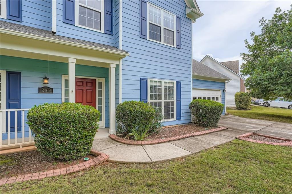 2409 Caneridge Way Southwest Marietta, GA 30064 - Photo 3 of 28 a view of a house with backyard and garden