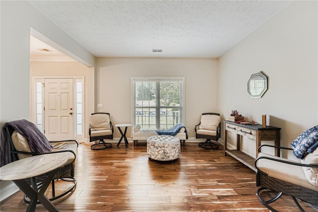 2409 Caneridge Way Southwest Marietta, GA 30064 - Photo 6 of 28 a living room with fireplace furniture and a large window