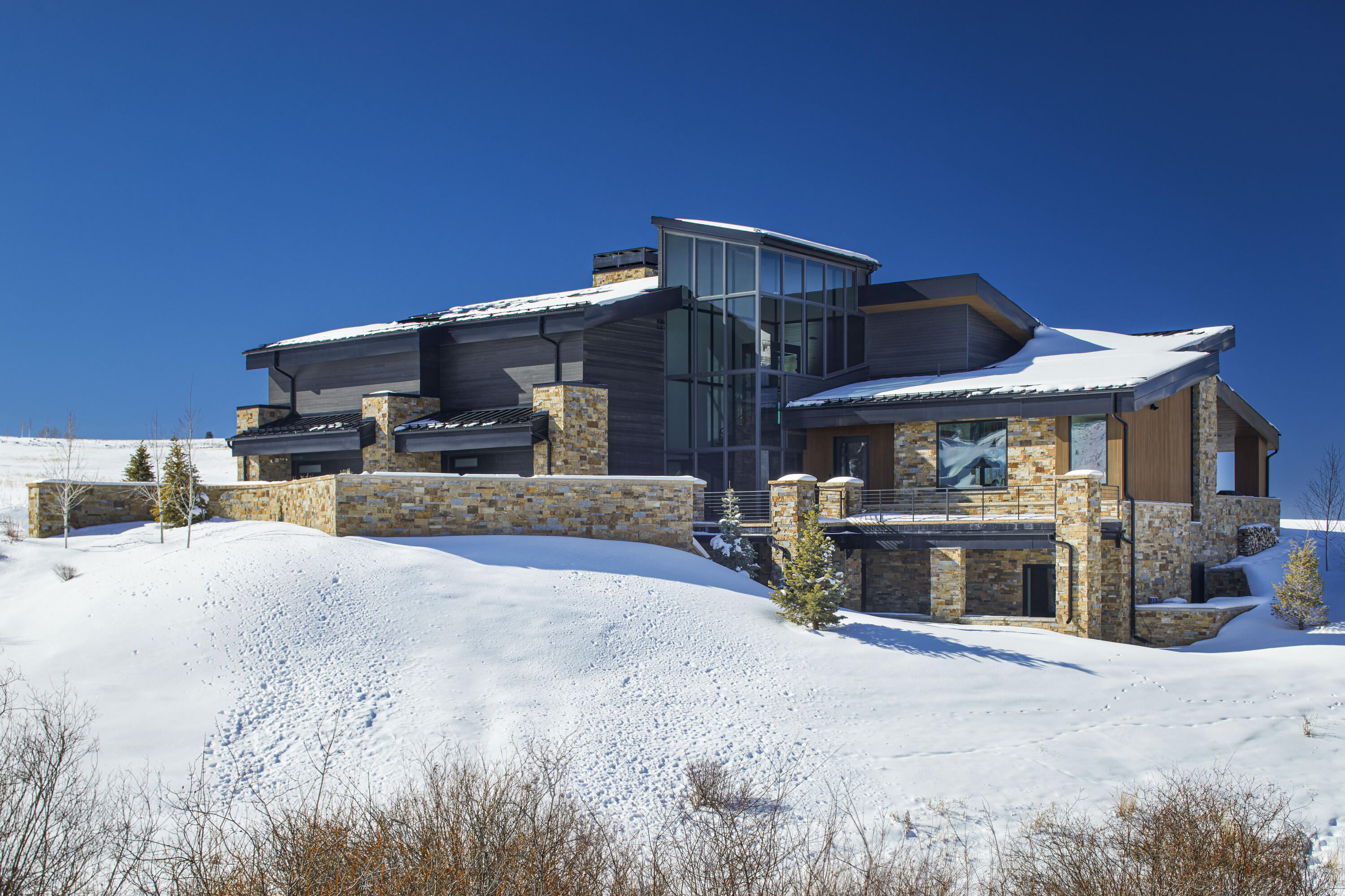 167 Adams Ranch Road Mountain Village, CO 81435 - Photo 6 of 28 a view of a house with a patio and a yard