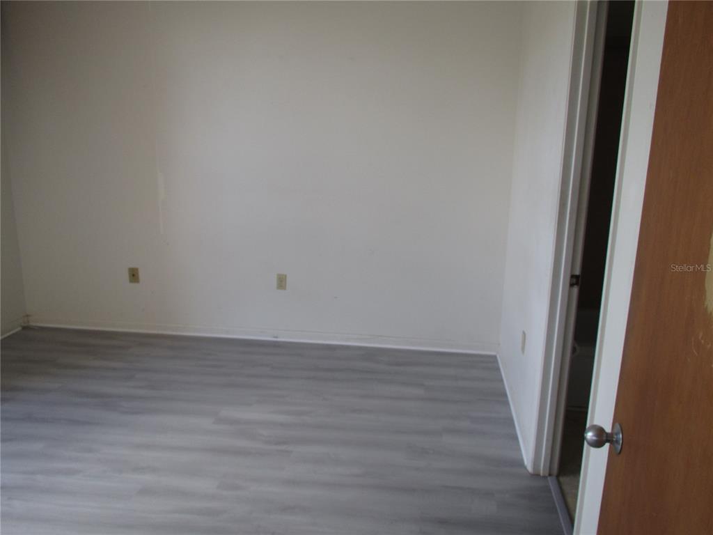 21405 Olean Boulevard, Unit 303 Port Charlotte, FL 33952 - Photo 5 of 7 a view of wooden floor